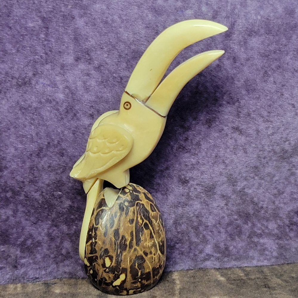 Handcarved Figurine Of A Toucan Perched On A Base Crafted From Tagua Nut‎